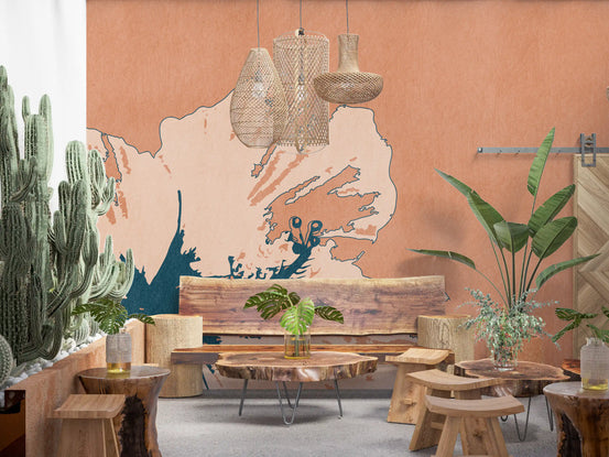 Dining room glows beside the Tropical Ink Flower wall mural in warm clay tones.