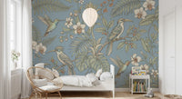Hummingbirds and broad leaves define this aviary wall mural design