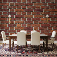 Dining room wall shows rustic red brick mural with pale grout lines