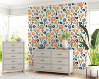 Home office wall set in Playful Meadow wallpaper of coral and yellow blooms
