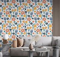 Living room wall finished in Playful Meadow wallpaper with mixed bloom shapes