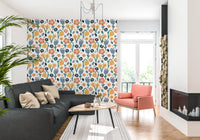 Living room corner finished with Playful Meadow wallpaper floral layout
