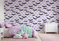 Playful bat shapes arranged in Purple Checkered Bats wallpaper design