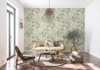 Bright lounge space with sage and gold peony wallpaper accent