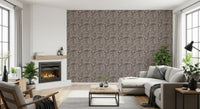 Rustic pebble mosaic wallpaper applied across the living room in organic ivory tones
