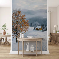 Kitchen-dining area stands in front of the golden tree winter wall mural
