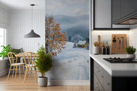 Behind the tree, foggy ridgelines roll away in the snowy haven wall mural scene