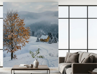 Golden tree and snowy haven wall mural set the tone in a calm green-toned living room