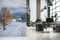 Quiet home office sits beside the snowy hillside wall mural in pale winter tones
