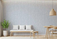 Dining room by gentle watercolor brushstroke wallpaper in cool gray wash.