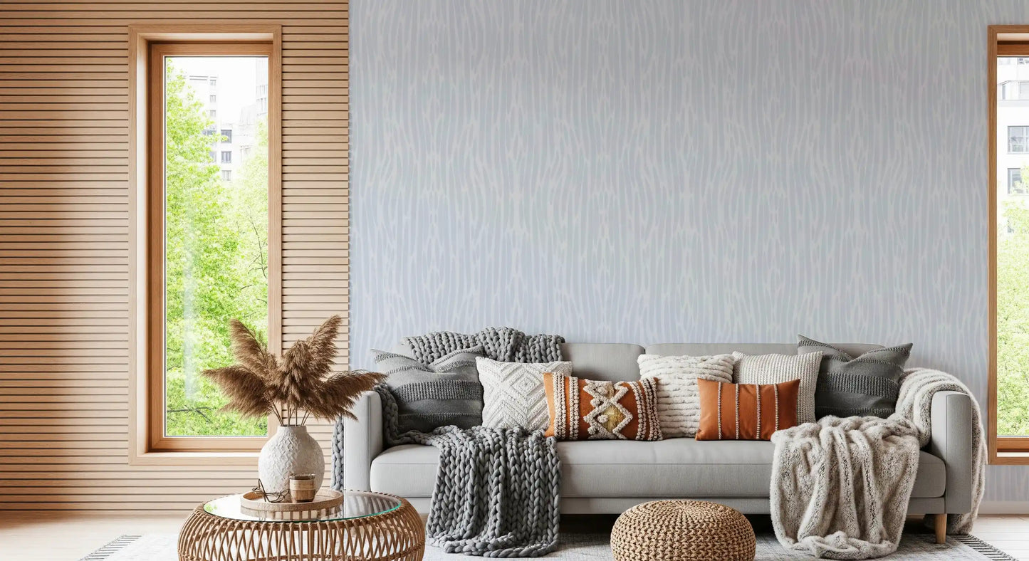 Hallway lined with watercolor strokes wallpaper in soft blue-gray wash tone.