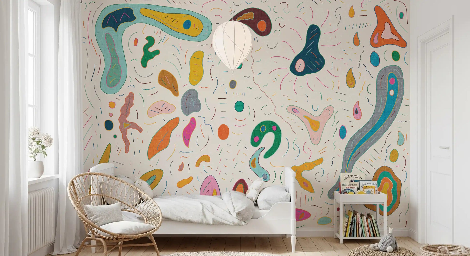 Organic blob shapes wall mural covering a complete boho kids' bedroom