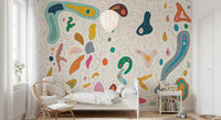 Organic blob shapes wall mural covering a complete boho kids' bedroom