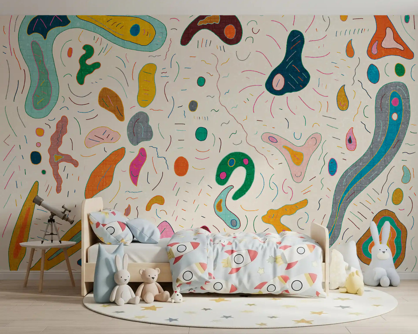 Multicolor blob shapes wall mural spanning the full playroom