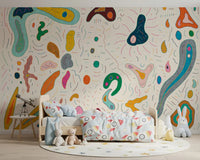 Multicolor blob shapes wall mural spanning the full playroom
