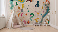 Scattered abstract shapes wall mural set in a modern kids' room