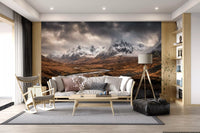 Highland river landscape wall mural filling a living room in warm amber and grey
