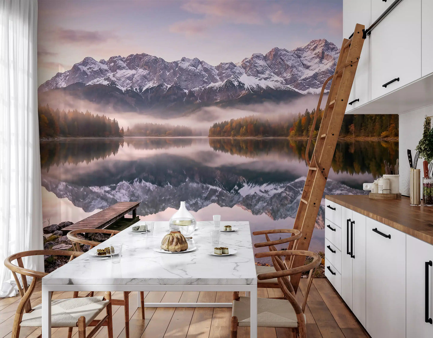 Misty mountain lake wall mural in a bright open kitchen-dining area