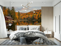 Fall lake cabin wall mural covering a bedroom in rich autumn foliage colours