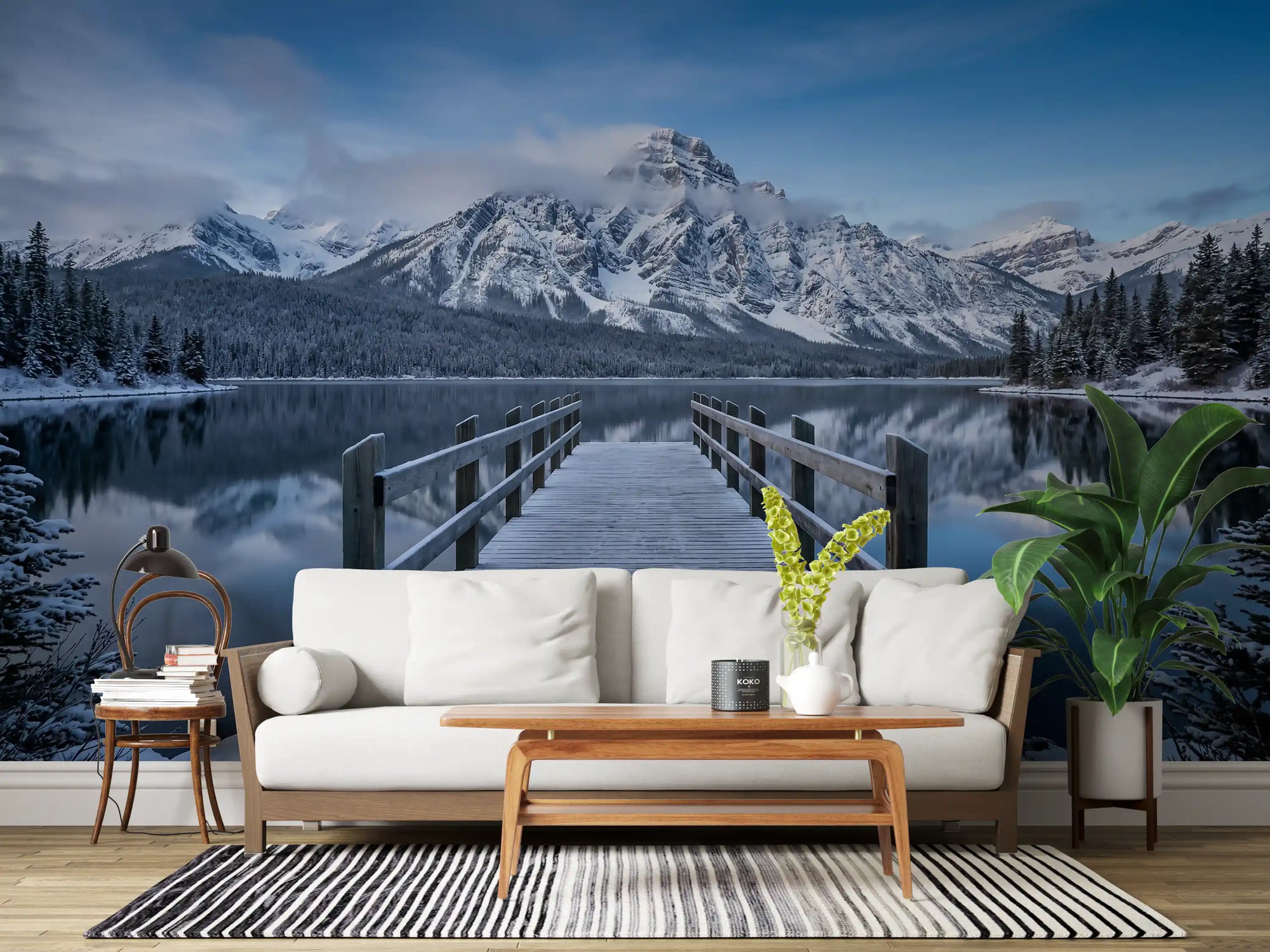 Blue winter lake wall mural occupying a living room feature surface in grey tones