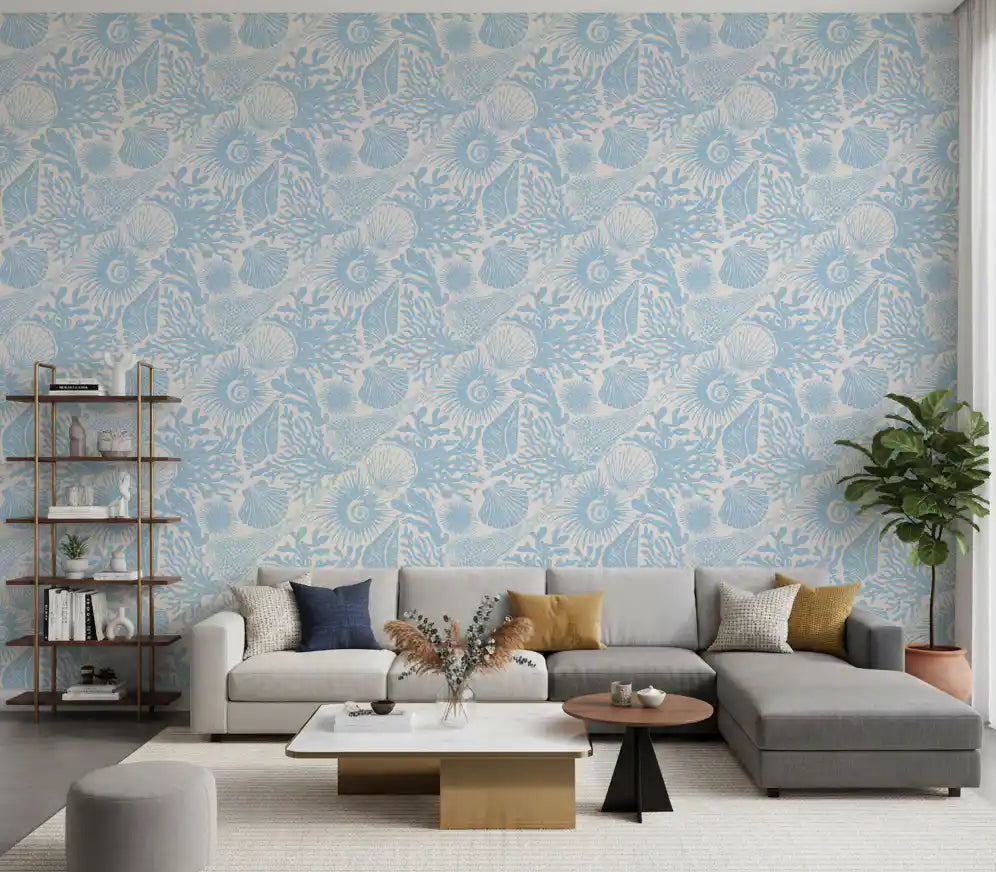 Boho Seashell Coral wallpaper covering a living room in soft blue and cream