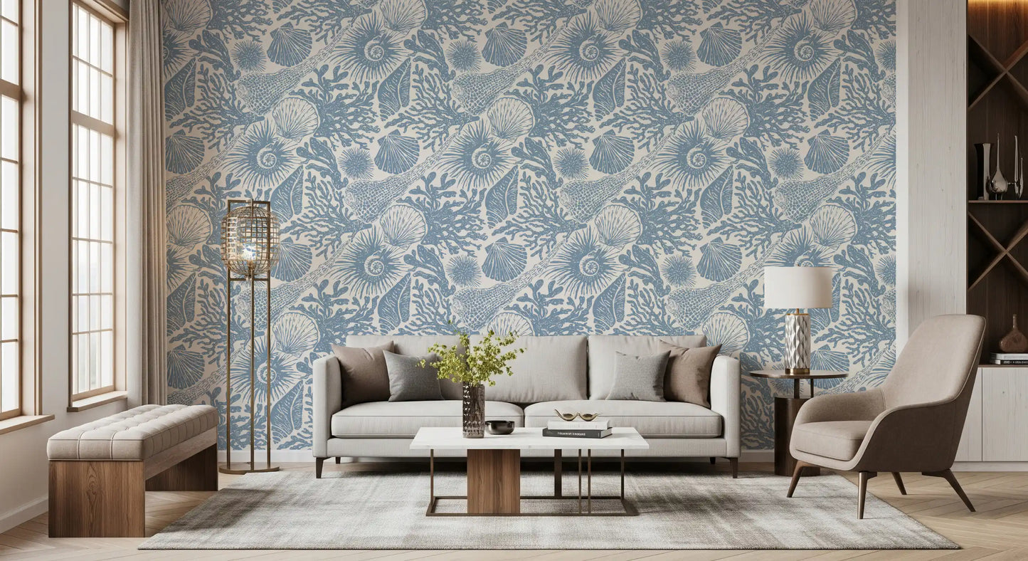 Conch and clam shapes overlapping in the muted blue boho wallpaper