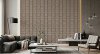Cosy bedroom backed by earthy pebble mosaic wallpaper in soft taupe tones