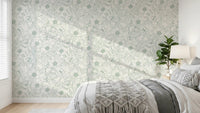 Bedroom dressed in Dog Rose and Butterflies green linework wallpaper
