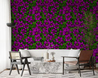 Modern living room set against magenta clematis vine wallpaper