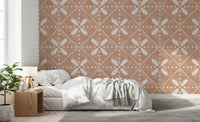 Tuscany Cotto Tiles Wallpaper features symmetric white floral motifs.