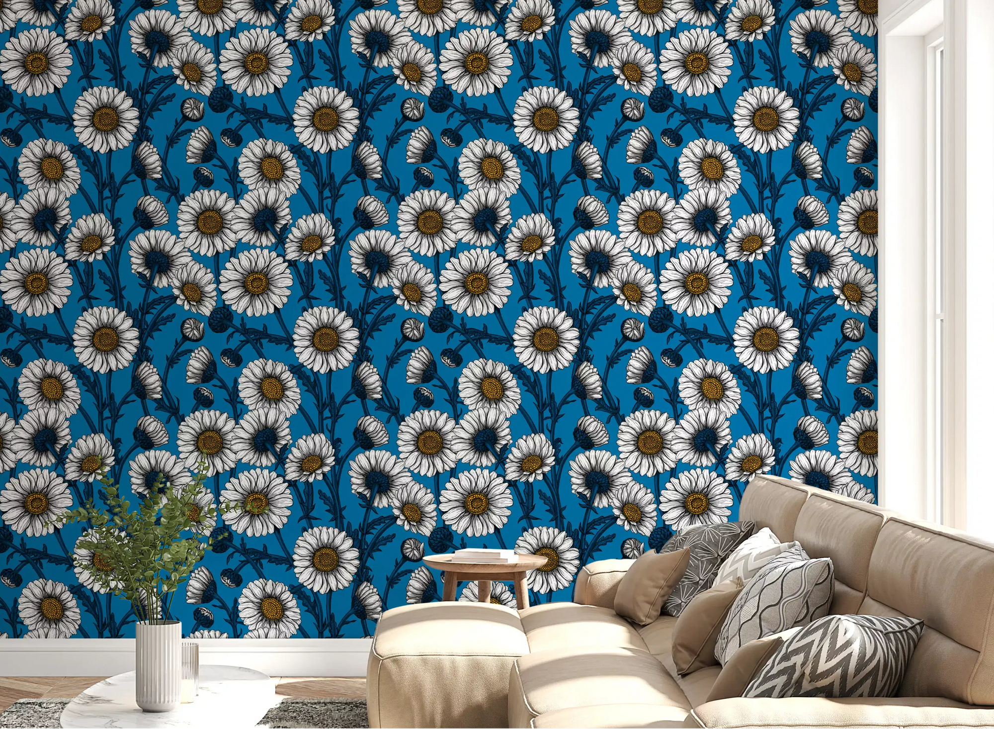 White Daisies on blue Wallpaper covering a modern living room .