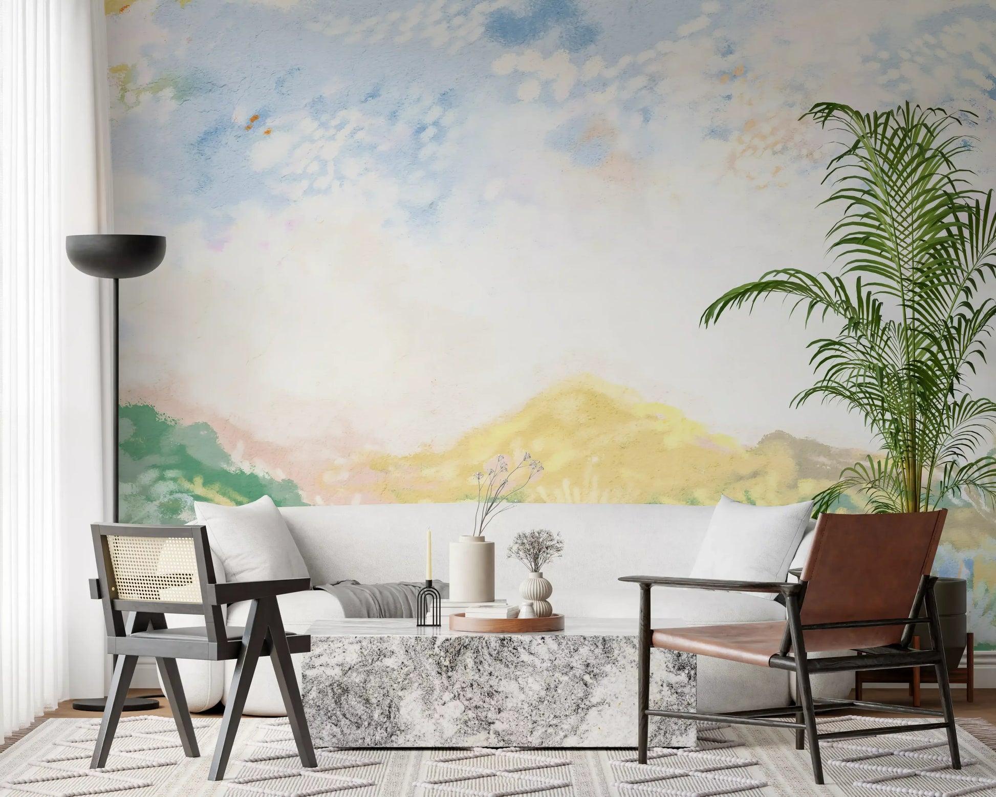 Spacious lounge setting enhanced by a Meadow painted landscape wall mural.