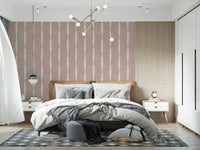 the cream textured distressed stripes on nude pink wallpaper.