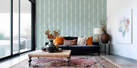 Organic brushstrokes blend perfectly within this soft blue distressed wallpaper.
