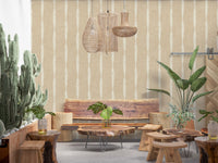 Restaurant sitting area featuring a neutral Stripes wallpaper.