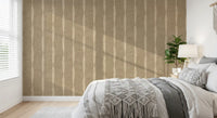 Warm beige stripes wallpaper frames a bedroom scene with quiet, earthy character.