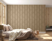 Tactile beige stripes wallpaper anchors a restful bedroom corner with worn charm.
