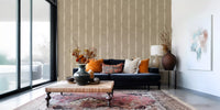Vertical kaki stripes wallpaper with feathered beige edges and earthy grainy texture.
