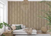 Beige and kaki textured stripes wallpaper sets a calm tone in the living room.
