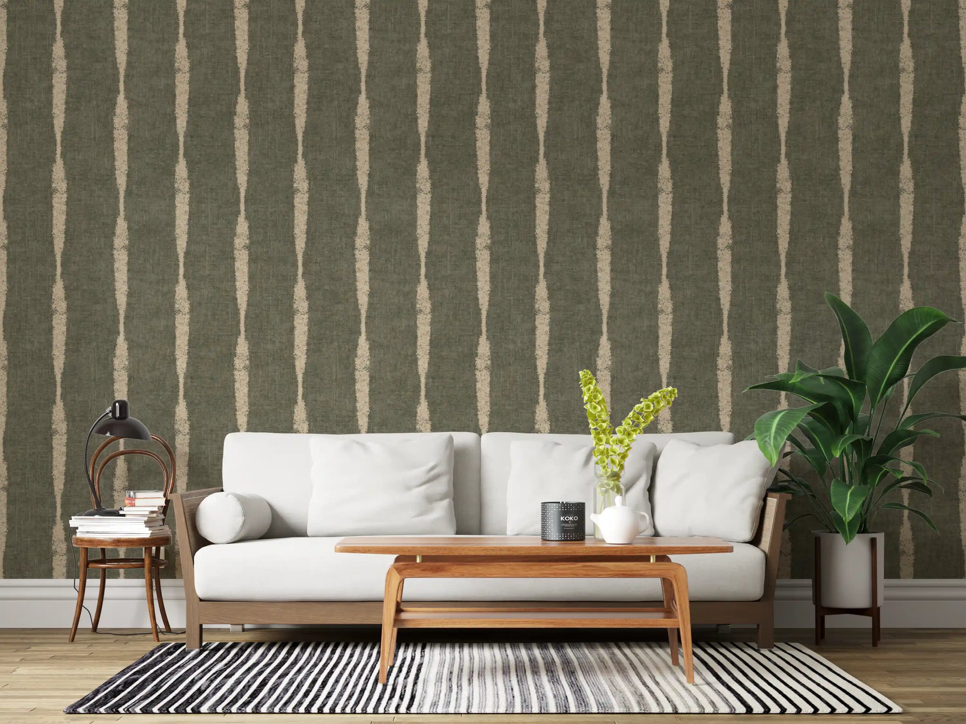 Cosy mood in this living room comes from chalky beige stripe wallpaper on green