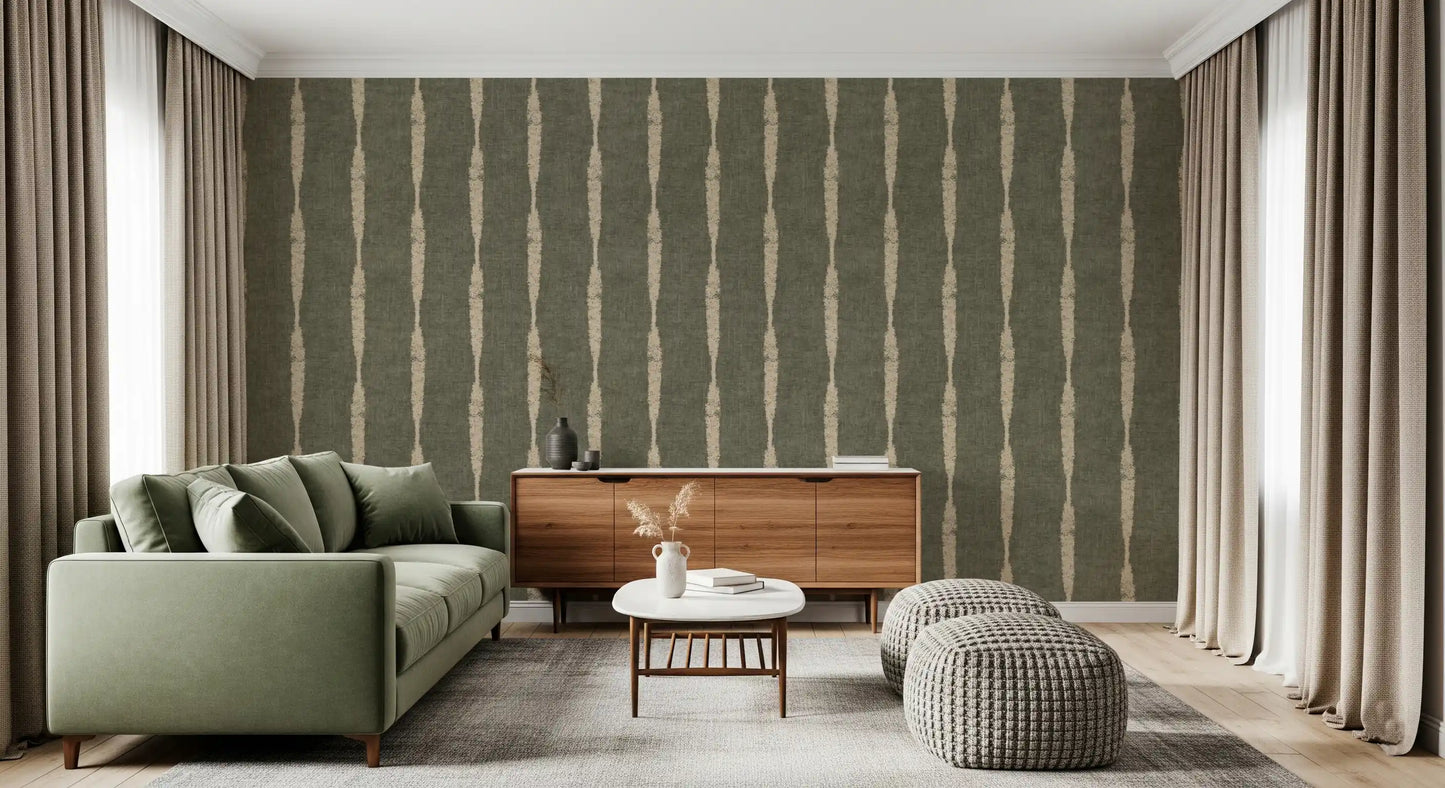 Muted green tones with chalky beige stripe wallpaper shaping a relaxed lounge