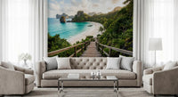 Turquoise water and jungle cliffs frame a Living room via the Emerald Bay wall mural.