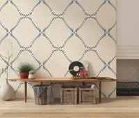 A warm ivory linen ground sets off the Slate Blue Dotted Lattice wallpaper.