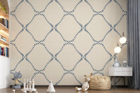 Small blue dots ring each diamond on this Beachy Boho Lattice wallpaper.