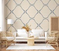 Linen-cream dots and slate diamonds dress an entryway in Dotted Lattice wallpaper.