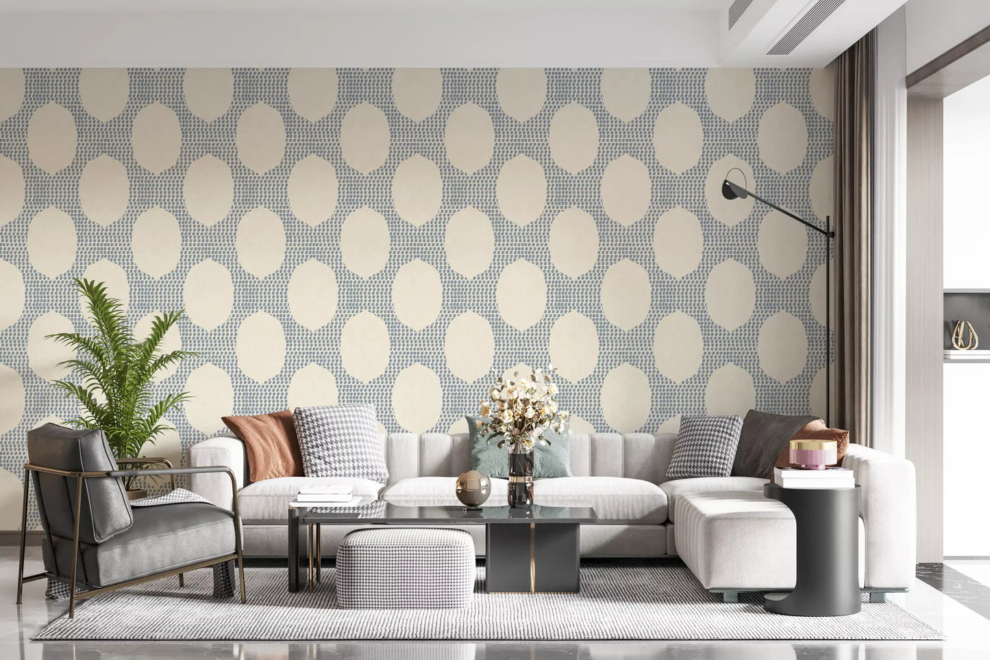Stippled blue dots add quiet structure to a sitting room in wallpaper
