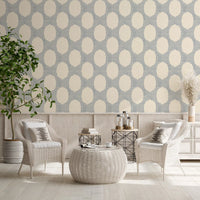 Stippled slate shading frames the oval shapes on this boho wallpaper
