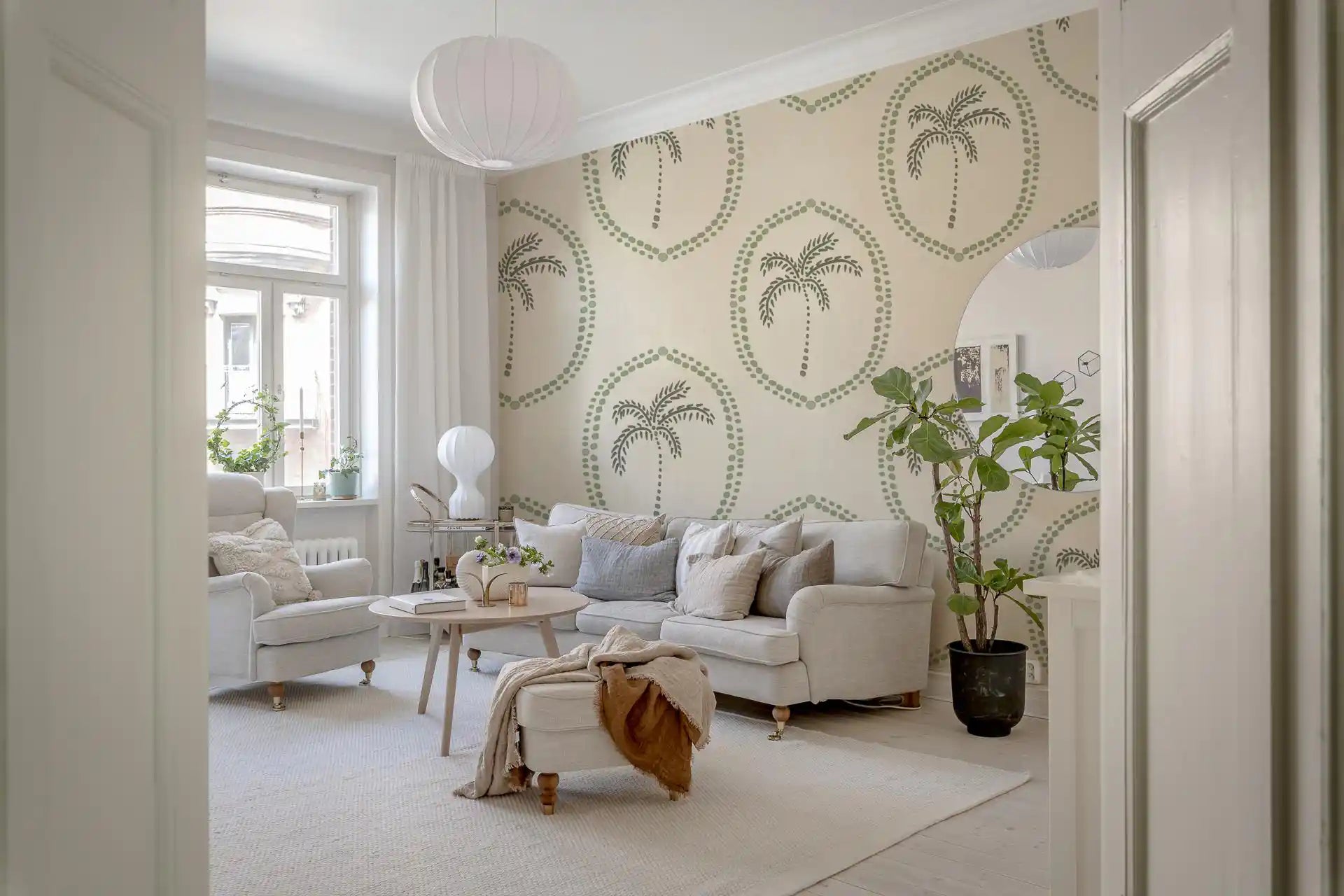 Beaded ovals and sage palms dress an entryway in Palm Medallion wallpaper.