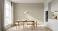 Minimalist dining area framed by textured cream fan scallops wallpaper.