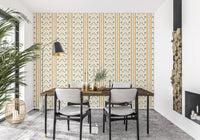 Intricate blue palm trees on a beige Marrakesh wallpaper.